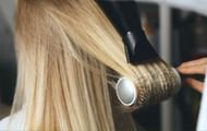 Blow drying with a fitted nozzle will give you the desired glass hair effect. (Image via InStyle)
